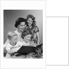 1950s Portrait Mother Two Daughters And Son Reading Book Together by Anonymous