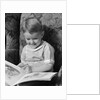 1930s 1940s Little Boy Sitting On Chair Reading Picture Book by Anonymous