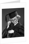 1950s Little Blond Girl Wearing Scholarly Glasses Graduation Cap And Gown Looking At Camera by Anonymous