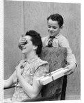 1930s 1940s Boy Son Surprising Woman Mother With Gift Wrapped Present by Anonymous