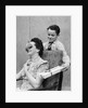 1930s 1940s Boy Son Surprising Woman Mother With Gift Wrapped Present by Anonymous