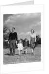 1940s Family Father Mother Son Daughter Holding Hands Together Walking On Grass by Anonymous