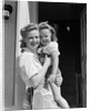 1940s Portrait Woman Mother Holding Girl Daughter Smiling Looking At Camera by Anonymous