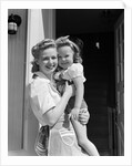 1940s Portrait Woman Mother Holding Girl Daughter Smiling Looking At Camera by Anonymous