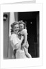 1940s Portrait Woman Mother Holding Girl Daughter Smiling Looking At Camera by Anonymous