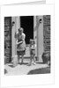 1940s Mother And Daughter Sweeping Sidewalk In Front Of Home by Anonymous