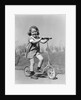 1930s Smiling Girl Playing On Scooter On Sidewalk Looking At Camera by Anonymous