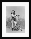 1930s Smiling Girl Playing On Scooter On Sidewalk Looking At Camera by Anonymous