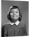 1950s Girl Page Boy Hair Bangs Smiling Funny Facial Expression Looking At Camera by Anonymous