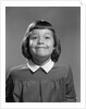 1950s Girl Page Boy Hair Bangs Smiling Funny Facial Expression Looking At Camera by Anonymous