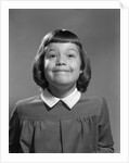 1950s Girl Page Boy Hair Bangs Smiling Funny Facial Expression Looking At Camera by Anonymous