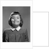 1950s Girl Page Boy Hair Bangs Smiling Funny Facial Expression Looking At Camera by Anonymous