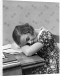 1930s Teenage Girl Sleeping Head Resting On Table Desk While Studying by Anonymous