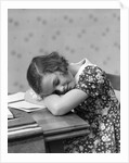 1930s Teenage Girl Sleeping Head Resting On Table Desk While Studying by Anonymous
