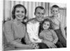 1960s Smiling Family Portrait Mother Father Son Daughter Looking At Camera by Anonymous
