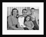 1960s Smiling Family Portrait Mother Father Son Daughter Looking At Camera by Anonymous