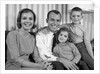 1960s Smiling Family Portrait Mother Father Son Daughter Looking At Camera by Anonymous