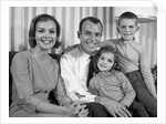 1960s Smiling Family Portrait Mother Father Son Daughter Looking At Camera by Anonymous