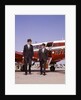 1960s Two Businessmen In Suits And Hats Carrying Briefcases Walking From A Small Twin Prop Business Airplane Talking by Anonymous
