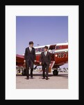1960s Two Businessmen In Suits And Hats Carrying Briefcases Walking From A Small Twin Prop Business Airplane Talking by Anonymous