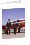 1960s Two Businessmen In Suits And Hats Carrying Briefcases Walking From A Small Twin Prop Business Airplane Talking by Anonymous