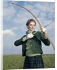 1960s 1970s Sports Woman Archer Holding Bow Preparing To Draw Arrow by Anonymous