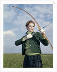 1960s 1970s Sports Woman Archer Holding Bow Preparing To Draw Arrow by Anonymous