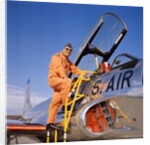 1960s 1970s Smiling Military Pilot Ladder Climbing Enter Cockpit Looking At Camera by Anonymous