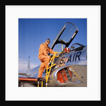 1960s 1970s Smiling Military Pilot Ladder Climbing Enter Cockpit Looking At Camera by Anonymous