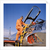 1960s 1970s Smiling Military Pilot Ladder Climbing Enter Cockpit Looking At Camera by Anonymous