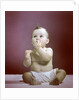1940s 1950s Baby Diaper Sitting Looking Up Fingers In Mouth by Anonymous