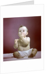 1940s 1950s Baby Diaper Sitting Looking Up Fingers In Mouth by Anonymous