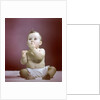 1940s 1950s Baby Diaper Sitting Looking Up Fingers In Mouth by Anonymous