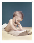 1960s Funny Baby Wearing Oversized Glasses Reading Big Book by Anonymous