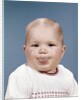 1960s Portrait Of Cute Blond Chubby Baby Looking At Camera Sticking Out Tongue by Anonymous