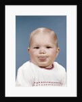 1960s Portrait Of Cute Blond Chubby Baby Looking At Camera Sticking Out Tongue by Anonymous