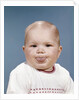 1960s Portrait Of Cute Blond Chubby Baby Looking At Camera Sticking Out Tongue by Anonymous