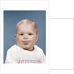 1960s Portrait Of Cute Blond Chubby Baby Looking At Camera Sticking Out Tongue by Anonymous