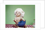 1960s Serious Baby In Chef Hat With Mixing Bowl And Spoon by Anonymous