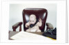 1960s Chubby Baby Sitting In Leather Office Chair Behind Desk Holding Talking On Telephone by Anonymous