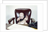 1960s Chubby Baby Sitting In Leather Office Chair Behind Desk Holding Talking On Telephone by Anonymous