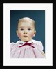 1960s Portrait Baby Girl Silly Facial Expression Red Bow At Collar Looking At Camera by Anonymous