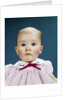 1960s Portrait Baby Girl Silly Facial Expression Red Bow At Collar Looking At Camera by Anonymous