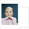 1960s Portrait Baby Girl Silly Facial Expression Red Bow At Collar Looking At Camera by Anonymous