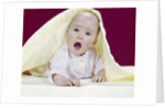 1960s Baby Mouth Wide Open Peeking Out From Under Yellow Blanket Looking At Camera by Anonymous