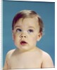 1960s Baby With Uncertain Facial Expression Deep Blue Eyes Looking Guilty Up And To The Side by Anonymous