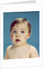1960s Baby With Uncertain Facial Expression Deep Blue Eyes Looking Guilty Up And To The Side by Anonymous