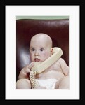 1960s Chubby Baby Sitting In Leather Office Chair Talking On Telephone by Anonymous