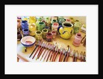 Paint brushes and colored paints by Anonymous