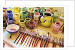 Paint brushes and colored paints by Anonymous